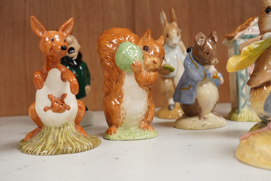 A collection of eighteen mixed Royal Doulton and Royal Albert figures of Beatrix Potter characters, largest 13cm high